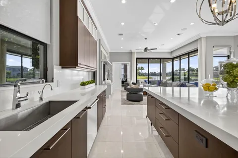 a work room with furniture a flat screen tv and a window