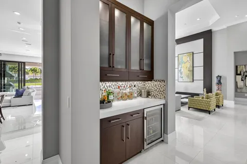 a view of a house with swimming pool and sitting area