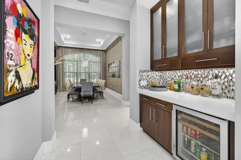 a view of house with swimming pool outdoor seating and barbeque oven