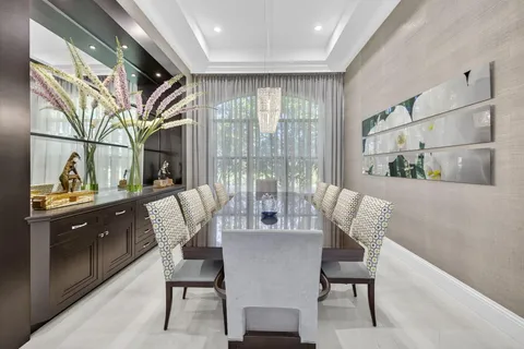 a living room with furniture fireplace and a large window