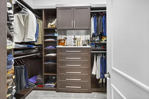 a view of swimming pool with table and chairs couches and palm trees