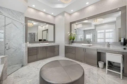 an aerial view of residential houses with outdoor space and street view