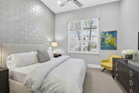 a dining room with furniture a chandelier and wooden floor