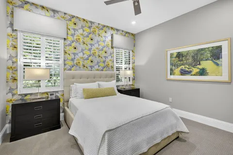 a view of a swimming pool with chairs