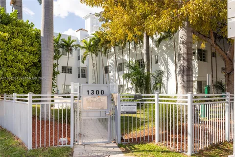 front view of a house with a iron fence