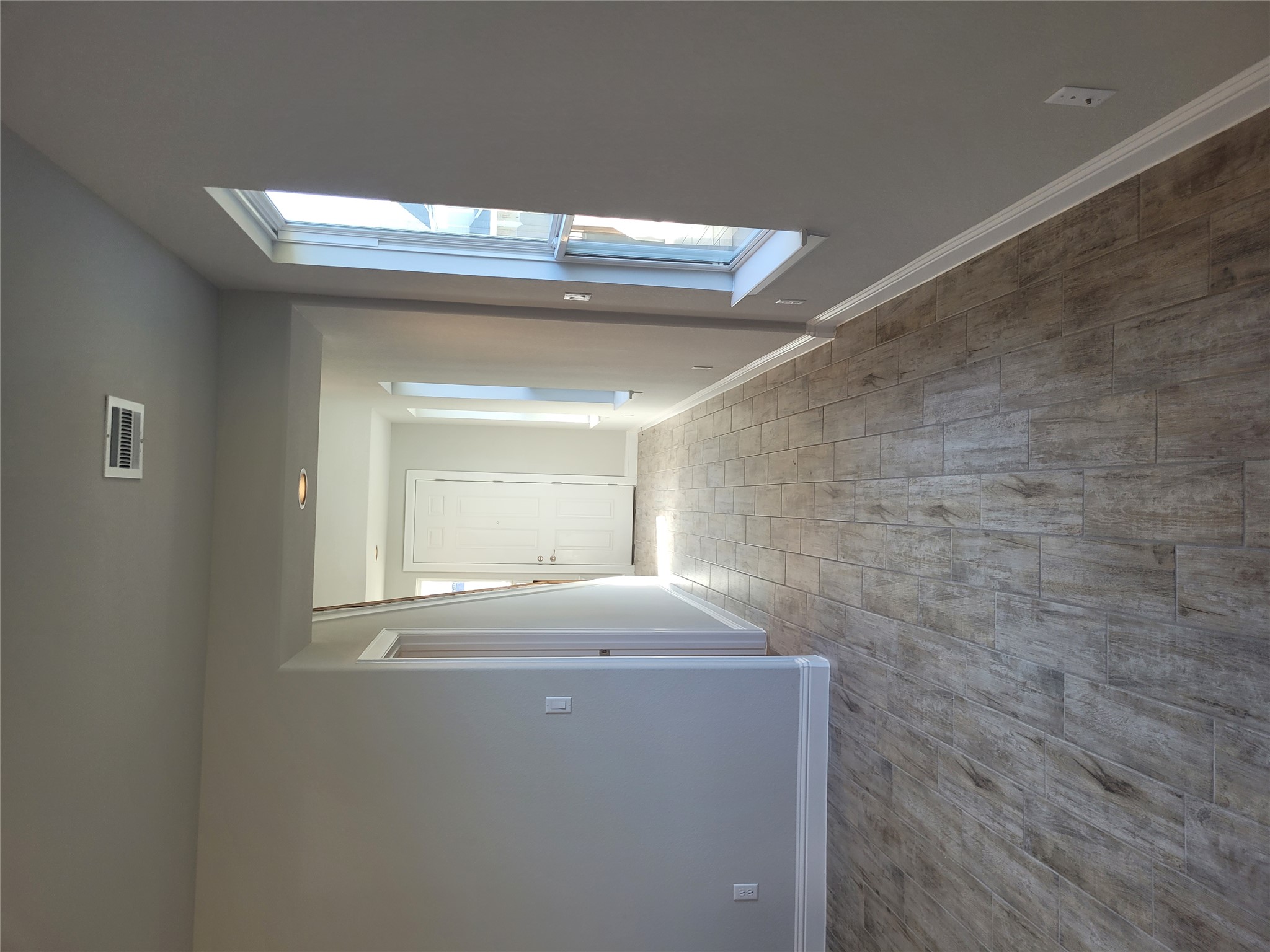 120 Free Stone Drive Georgetown, TX 78628 - Photo 6 of 40 Warm, wood-look tile flooring guides you through this bright and inviting entryway.