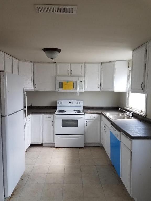 899 New Light Road Winfield, TN 37892 - Photo 11 of 12 a kitchen with cabinets appliances and a window