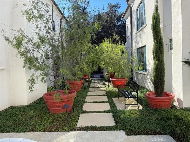 a view of a backyard with sitting area