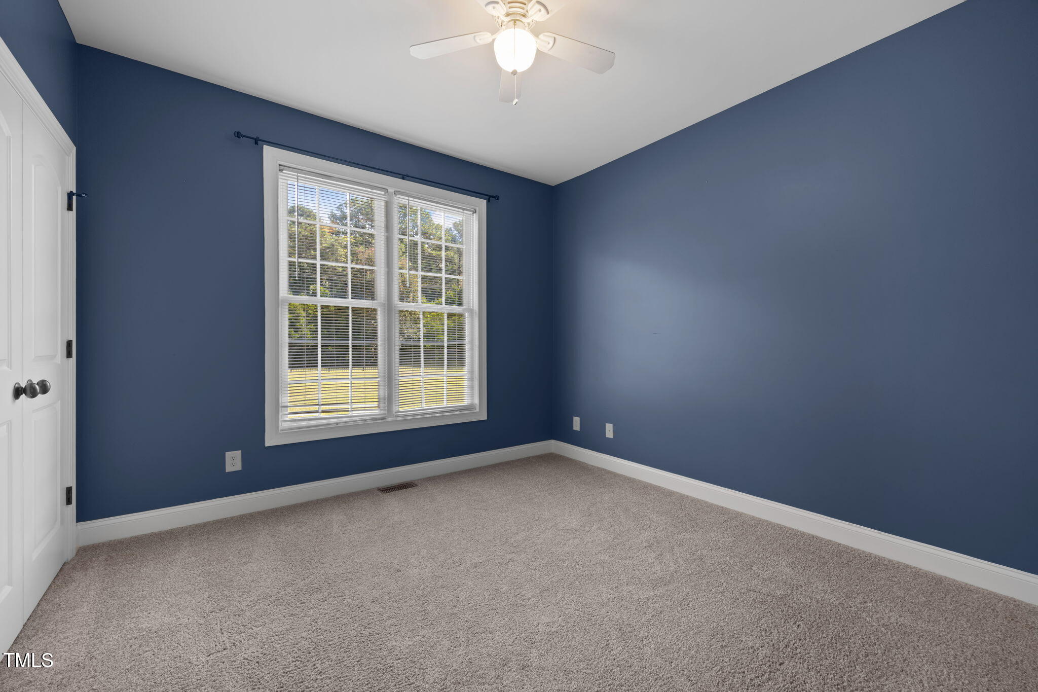 6313 Southern Charm Lane Raleigh, NC 27603 - Photo 23 of 38 an empty room with a window