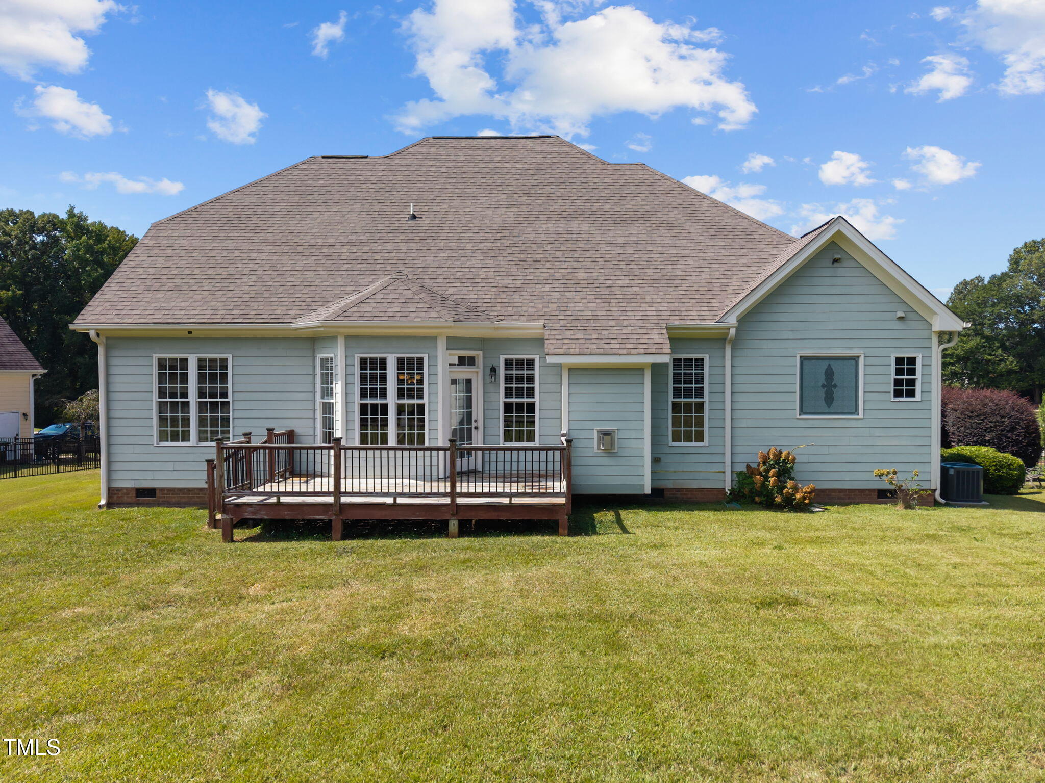 6313 Southern Charm Lane Raleigh, NC 27603 - Photo 31 of 38 a view of a house with a yard and sitting area