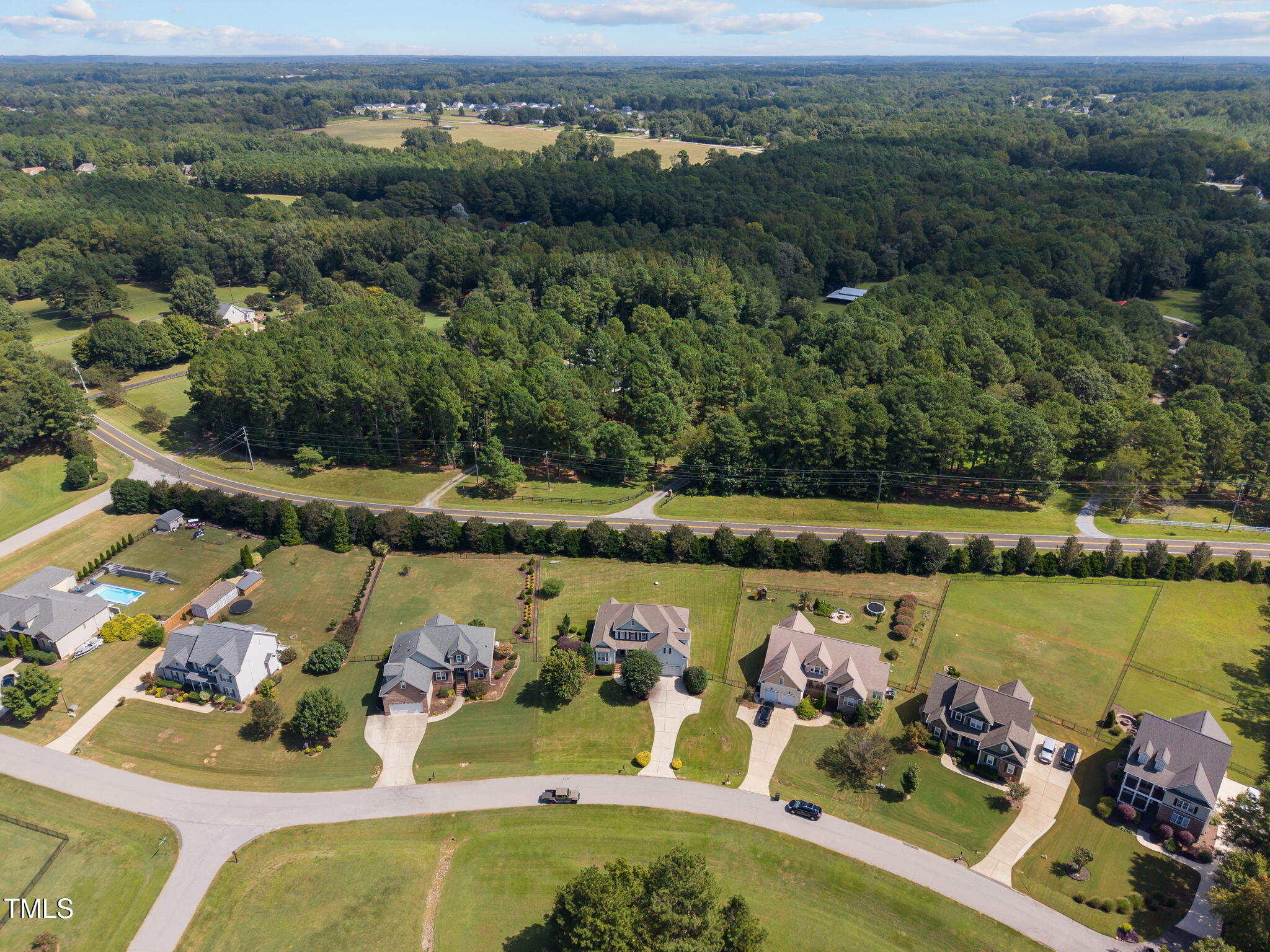 6313 Southern Charm Lane Raleigh, NC 27603 - Photo 37 of 38 an aerial view of a house with a lake view