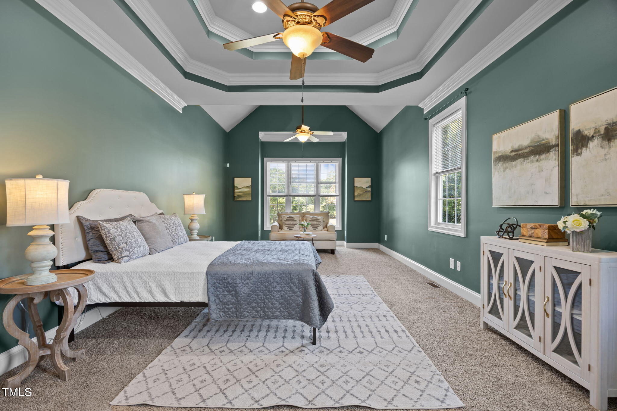 6313 Southern Charm Lane Raleigh, NC 27603 - Photo 4 of 38 a bedroom with a bed and a chandelier