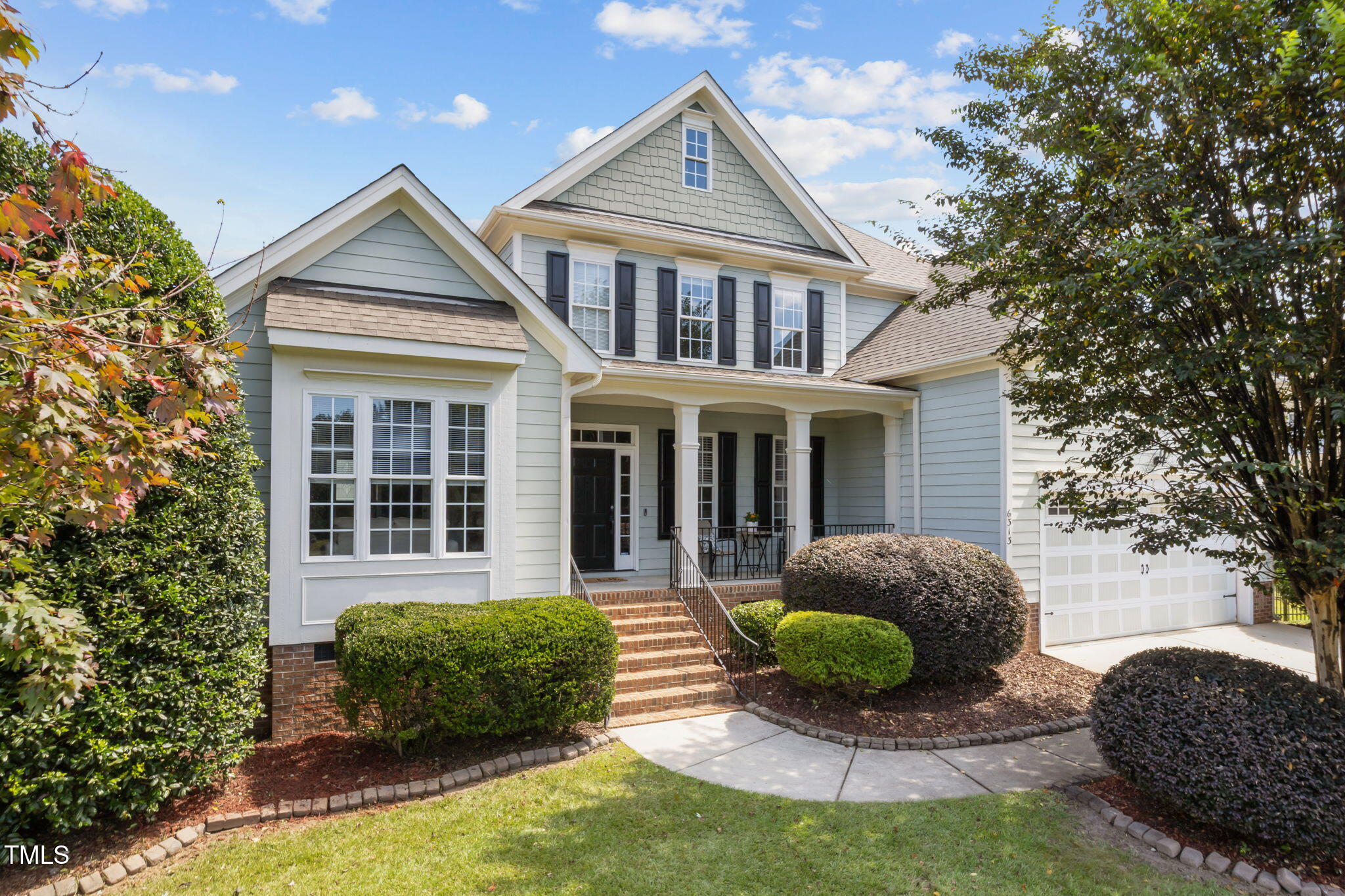 6313 Southern Charm Lane Raleigh, NC 27603 - Photo 5 of 38 a view of a house with a yard and potted plants