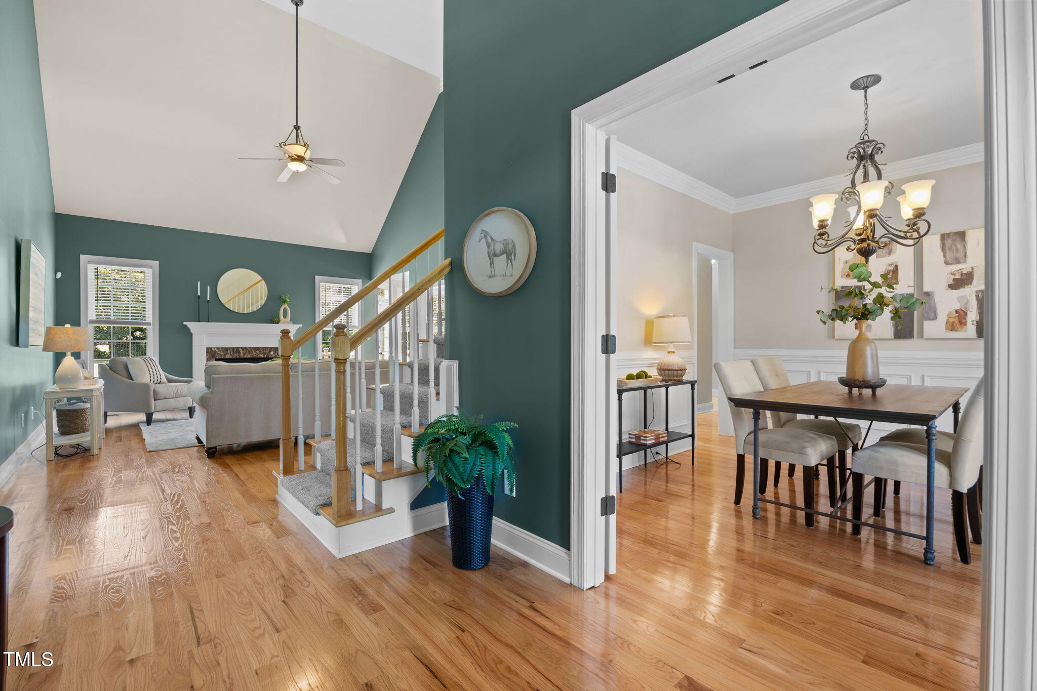 6313 Southern Charm Lane Raleigh, NC 27603 - Photo 8 of 38 a view of a dining room with furniture and wooden floor