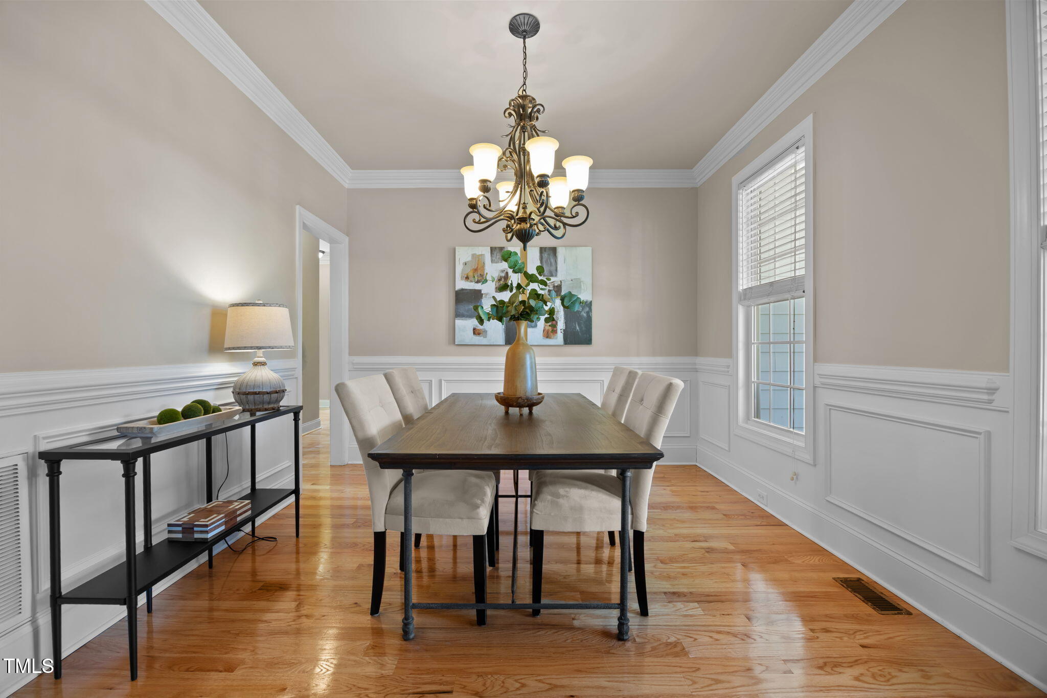 6313 Southern Charm Lane Raleigh, NC 27603 - Photo 9 of 38 a view of a dining room with furniture window and wooden floor