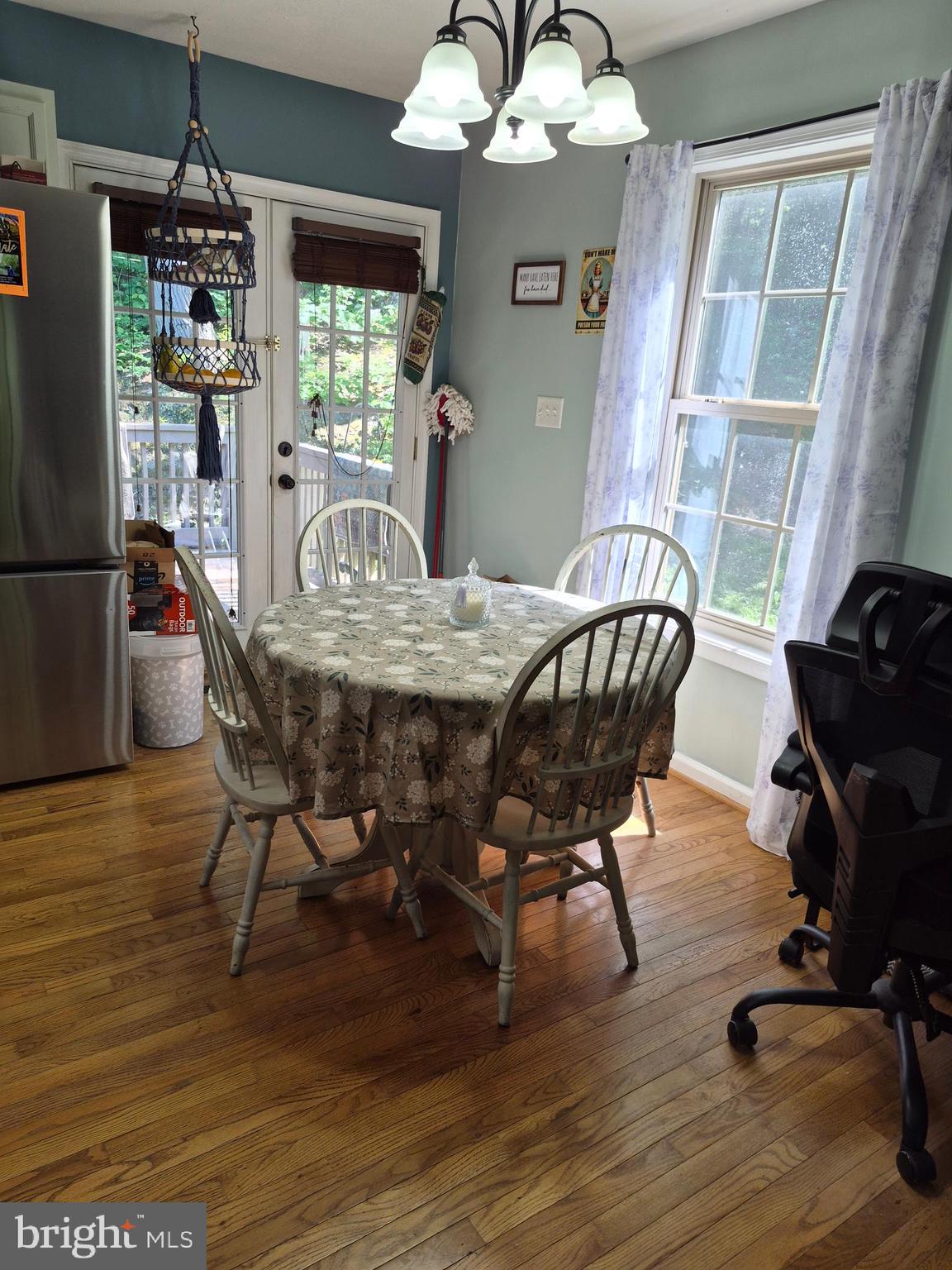 1440 Drummer Hill Road Front Royal, VA 22630 - Photo 21 of 42 a view of a dining room with furniture window and wooden floor