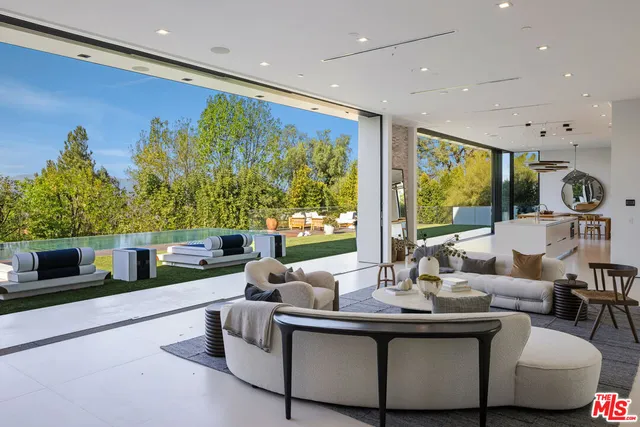 a kitchen with stainless steel appliances kitchen island granite countertop a sink and cabinets