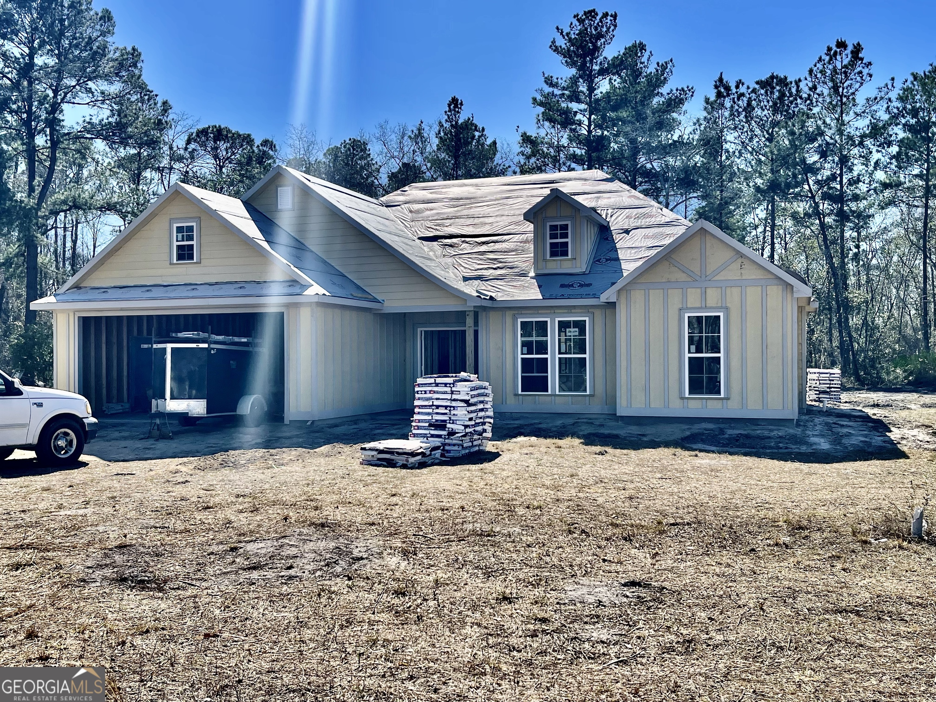 108 Ira Corbitt Road Lakeland, GA 31635 - Photo 2 of 23 a front view of a house with a yard and garage