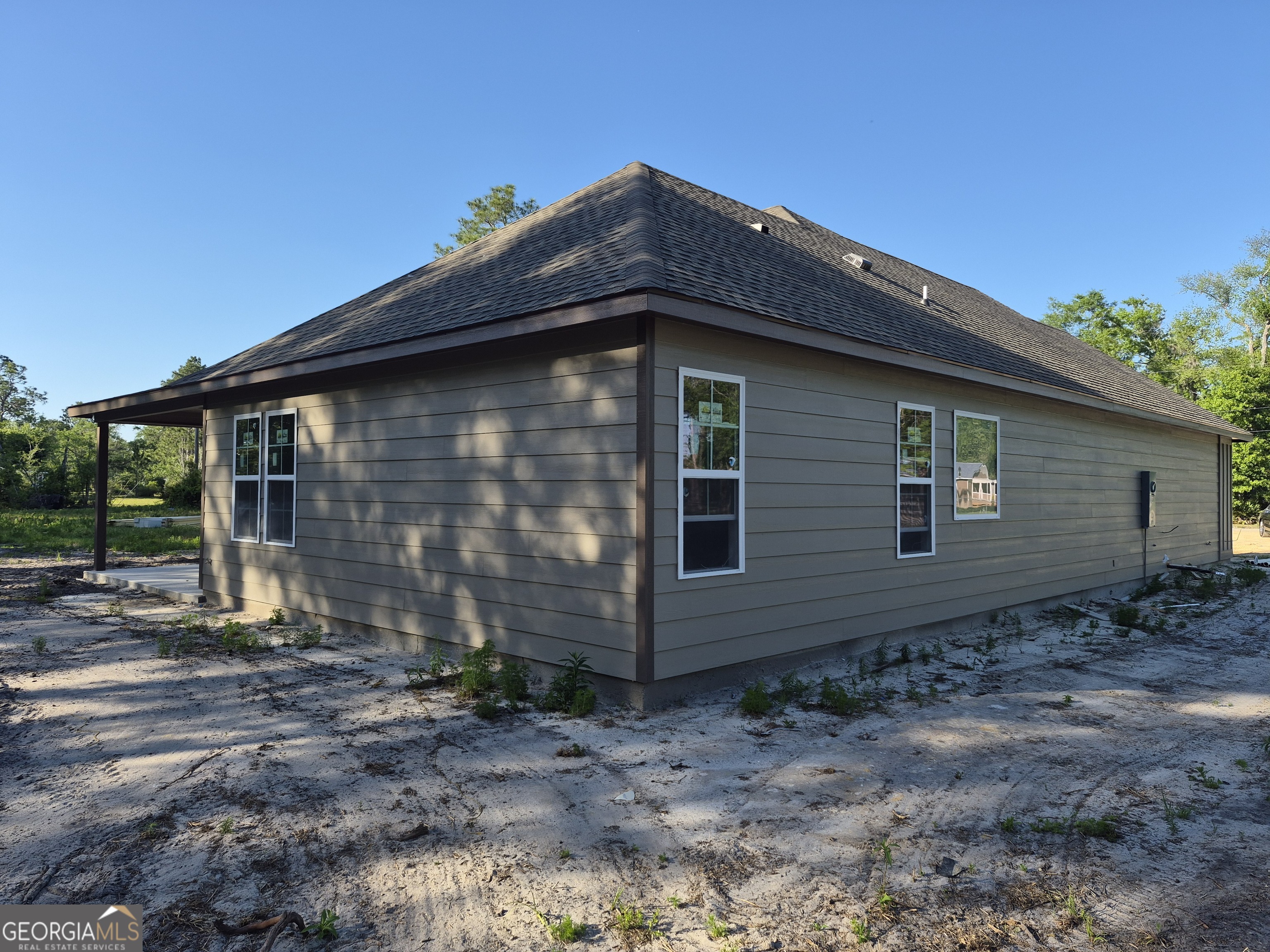 108 Ira Corbitt Road Lakeland, GA 31635 - Photo 8 of 23 a front view of a house with garden