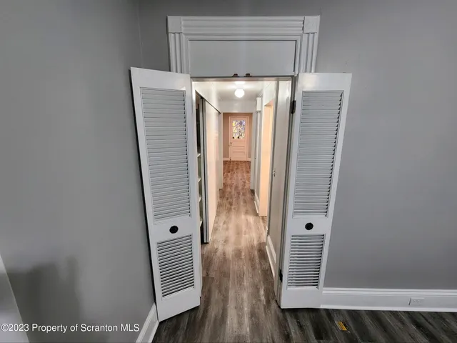 a view of cabinet with wooden floor