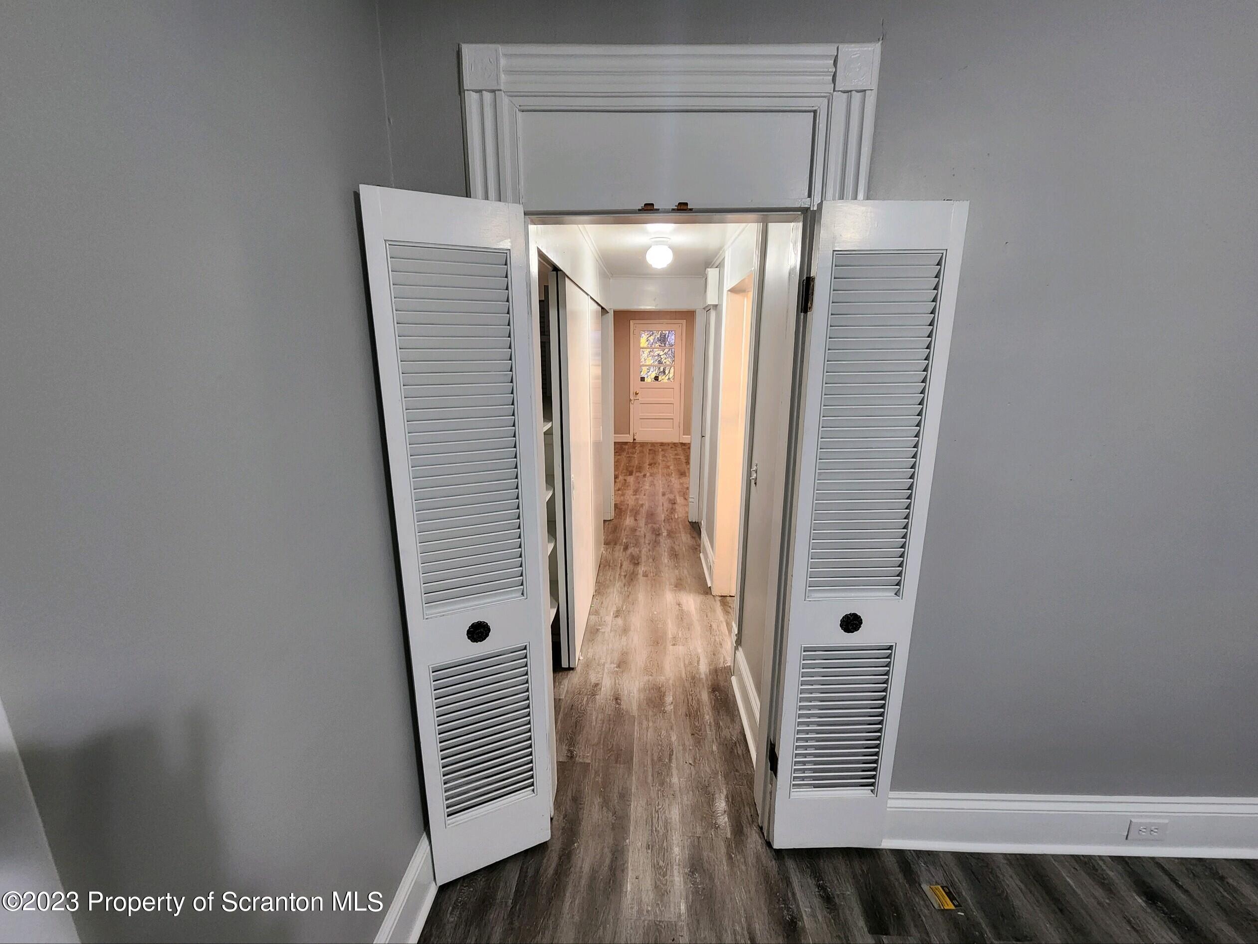 817 Monroe Avenue, Unit 1 Scranton, PA 18510 - Photo 6 of 8 a view of cabinet with wooden floor