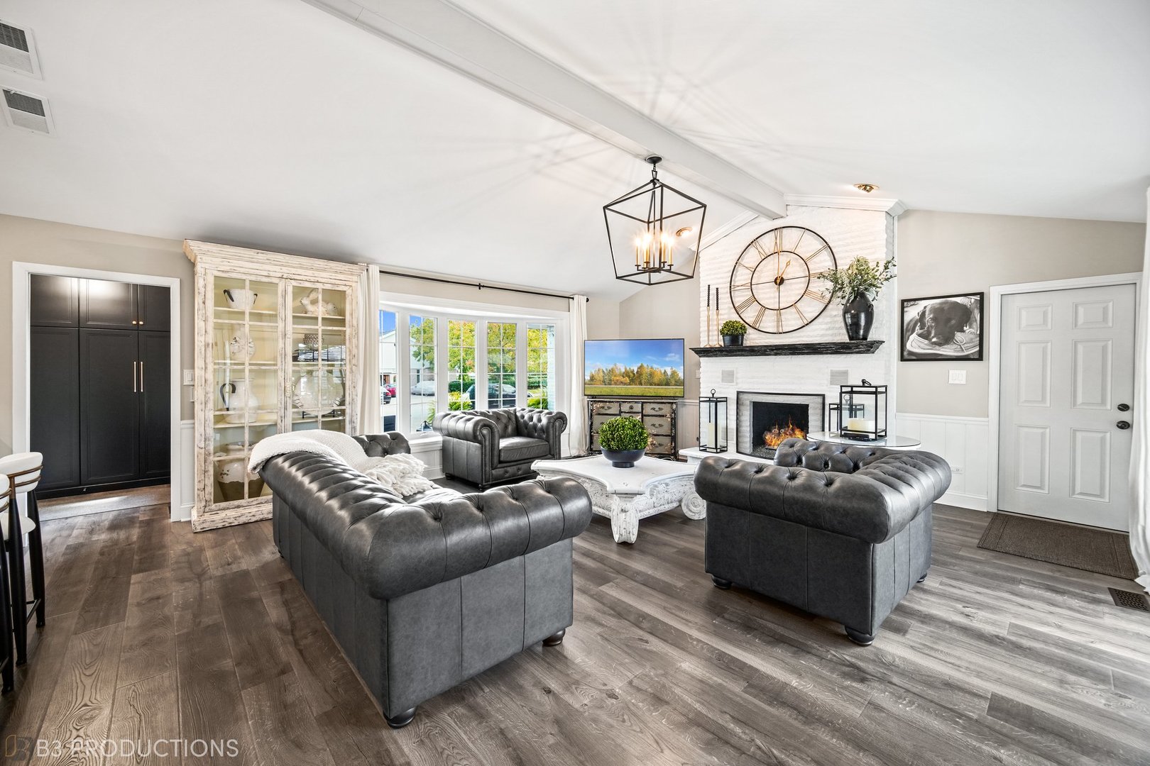 238 Larch Road Frankfort, IL 60423 - Photo 6 of 27 a living room with furniture a fireplace and a large window