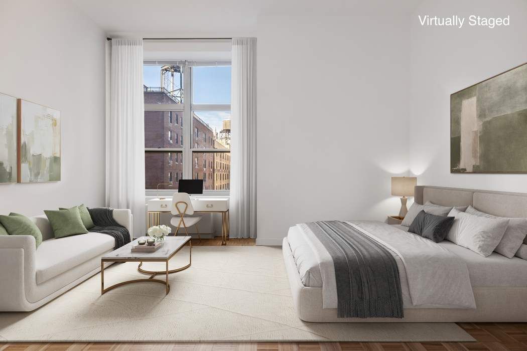 a bedroom with a bed and glass window