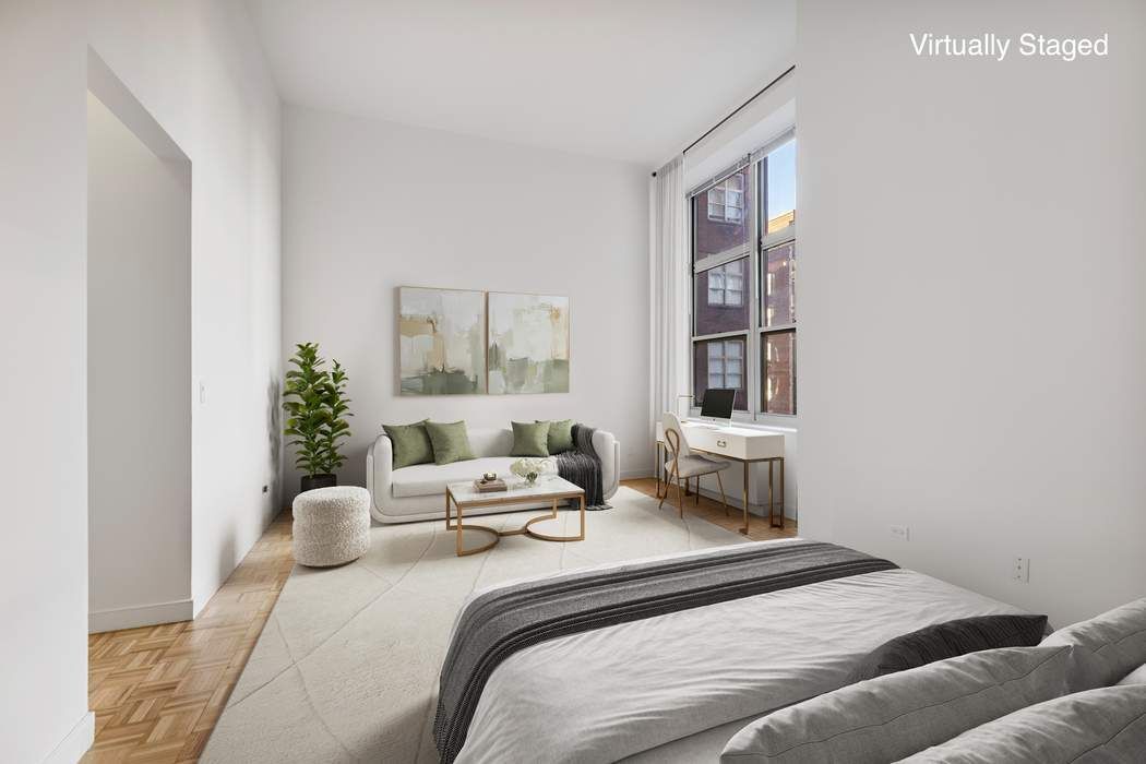 120 East 87th Street, Unit R14K Manhattan, NY 10128 - Photo 2 of 14 a bedroom with a bed and a window