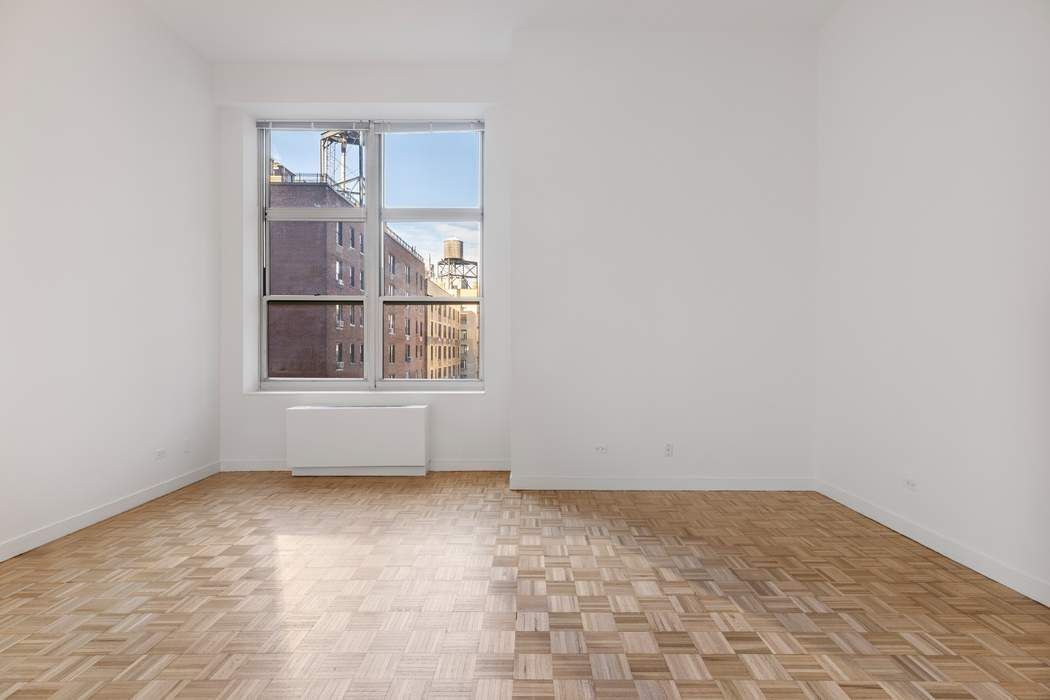 120 East 87th Street, Unit R14K Manhattan, NY 10128 - Photo 3 of 14 an empty room with a window