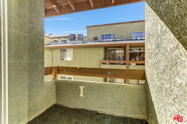 a view of a kitchen with a sink and cabinets