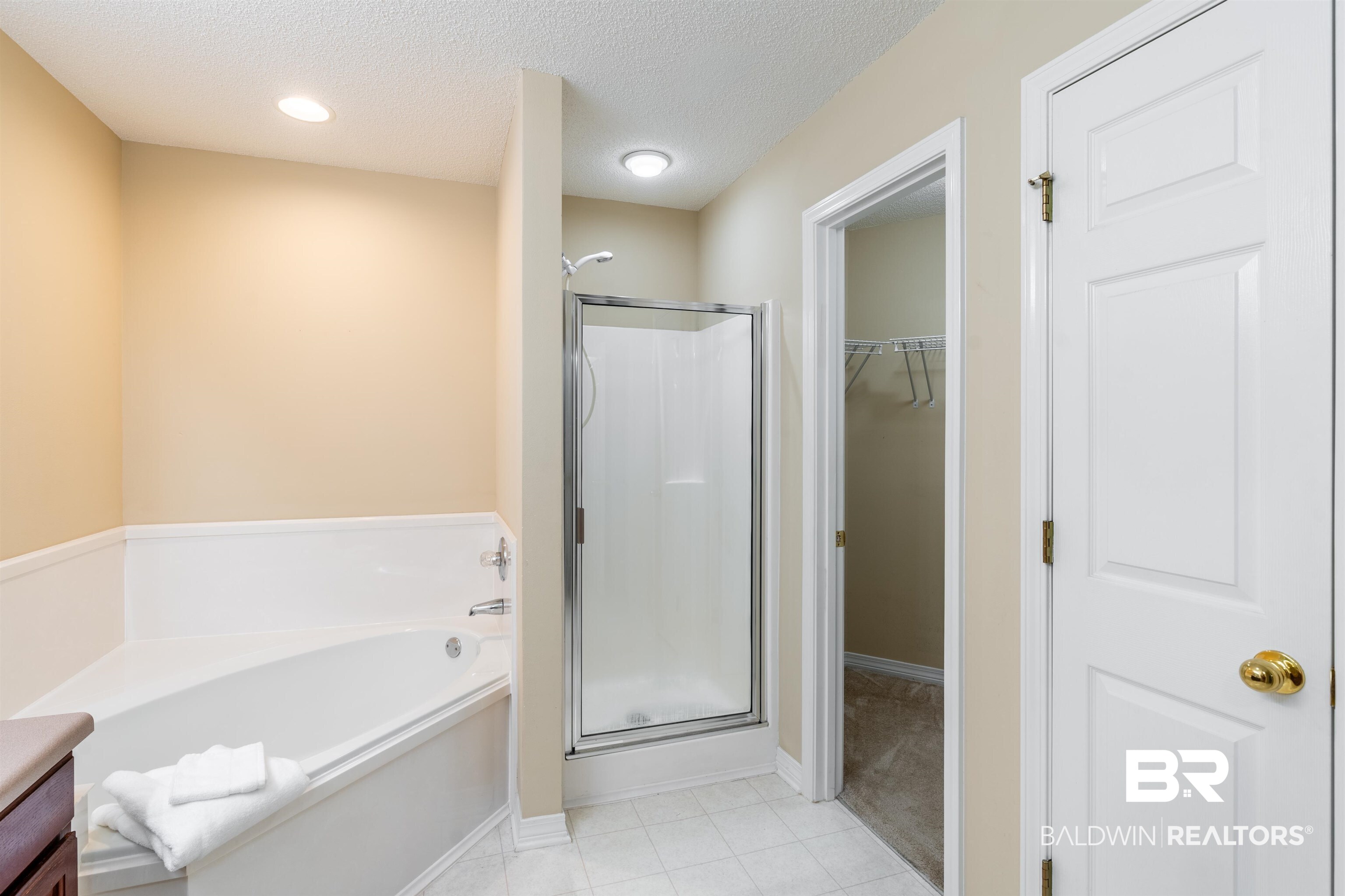 1784 Harrington Way Mobile, AL 36695 - Photo 13 of 18 Bathroom featuring vanity, separate shower and tub, and a textured ceiling