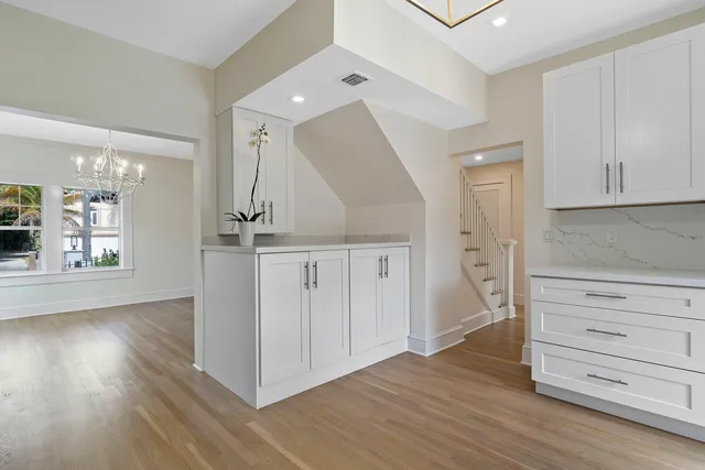 a bathroom with a window and a shower