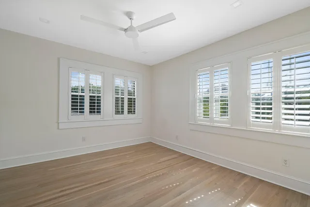 a bathroom with a toilet a sink and a mirror