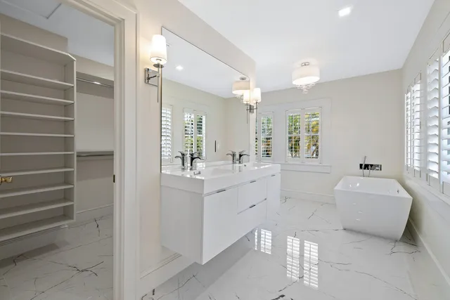 a view of a swimming pool with a yard and palm trees