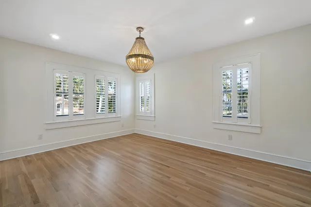 a kitchen with stainless steel appliances granite countertop a stove and white cabinets