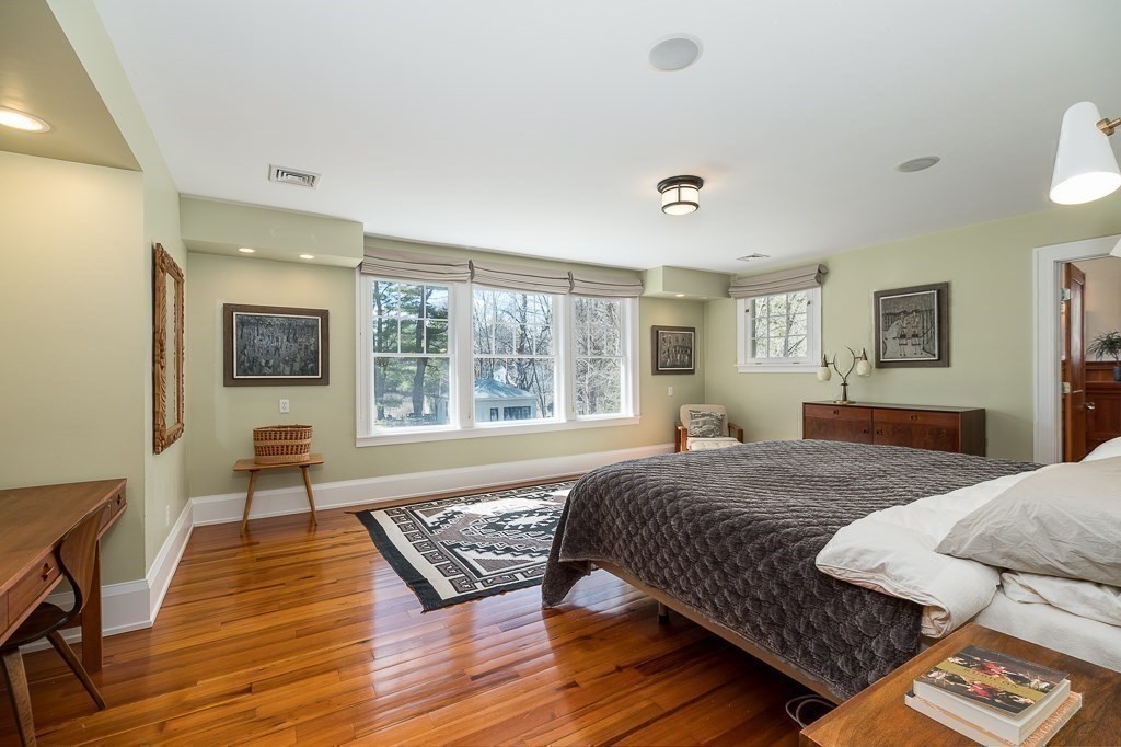 8 Walnut Road Wenham, MA 01984 - Photo 20 of 42 a bedroom with a bed and wooden floor