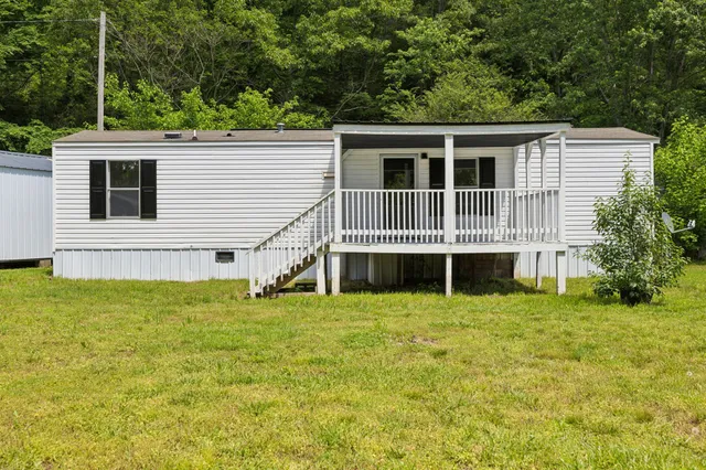 a view of front of house with a yard