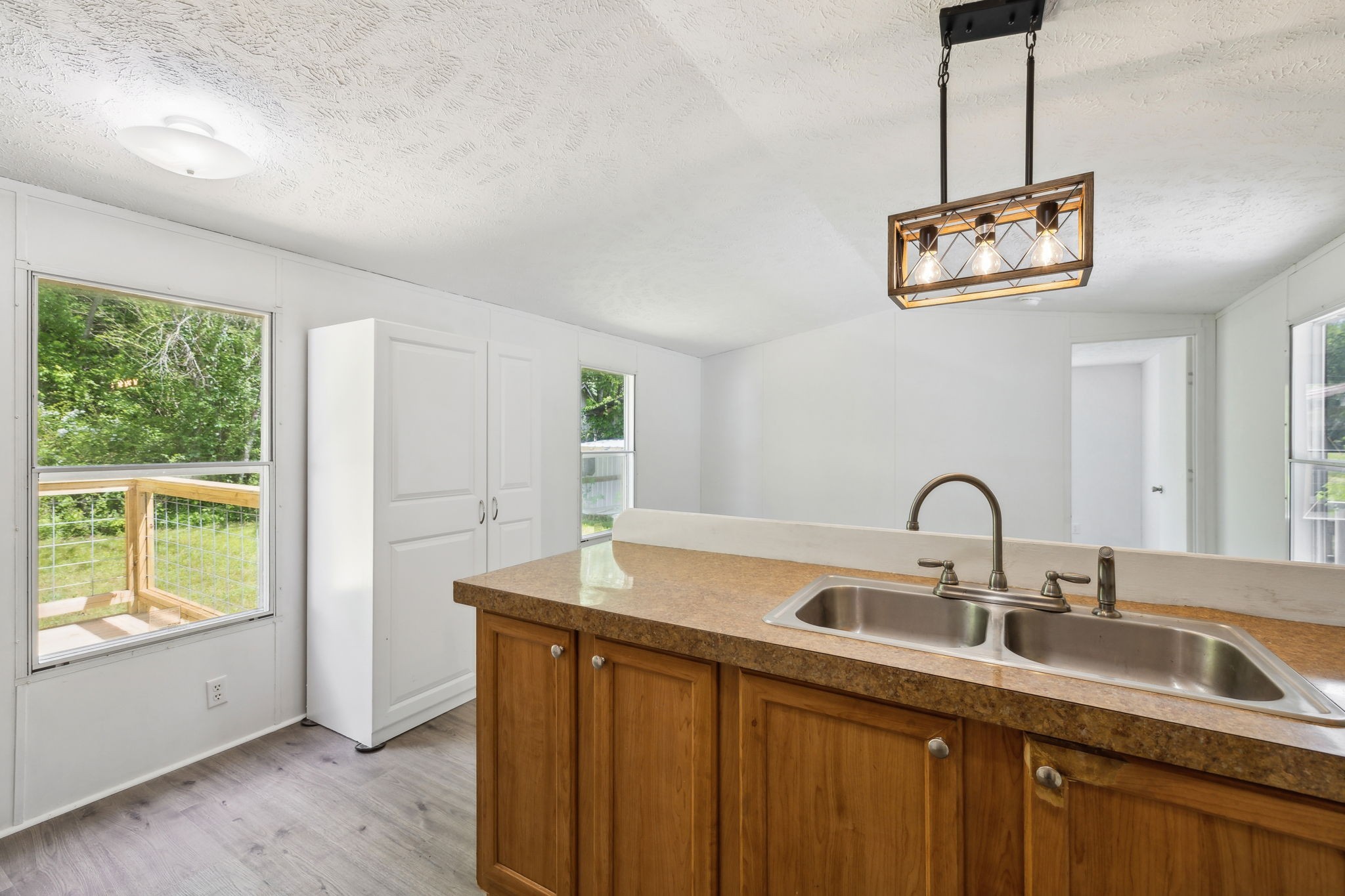 161 Longbranch Road Hohenwald, TN 38462 - Photo 11 of 28 a kitchen with a sink and a large window