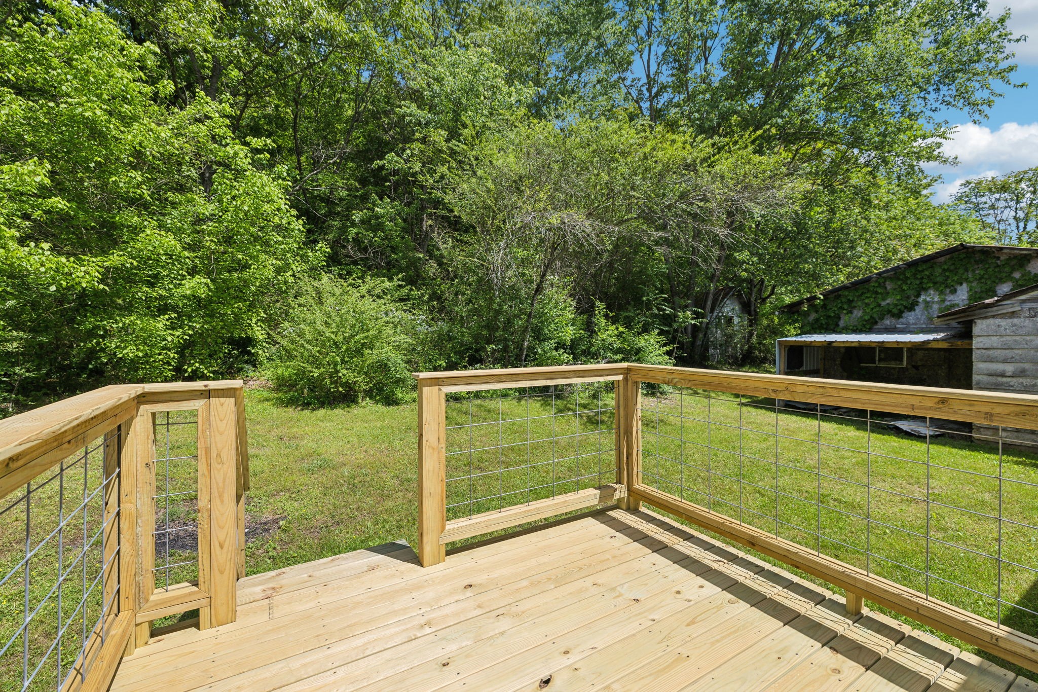 161 Longbranch Road Hohenwald, TN 38462 - Photo 22 of 28 a view of outdoor space with deck and yard