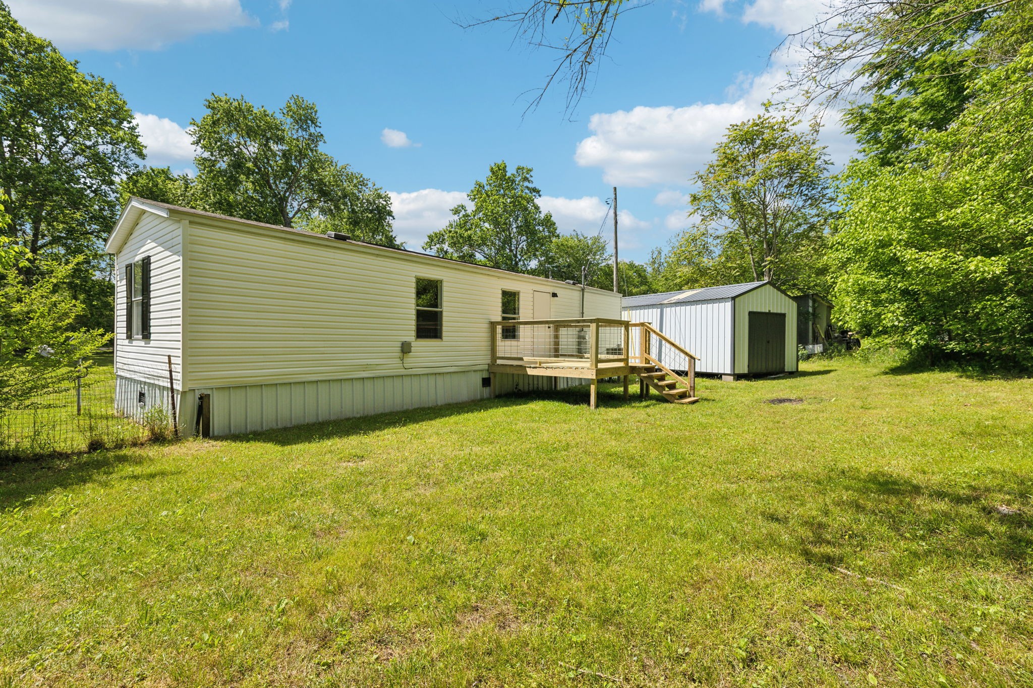 161 Longbranch Road Hohenwald, TN 38462 - Photo 26 of 28 a view of a house with a yard