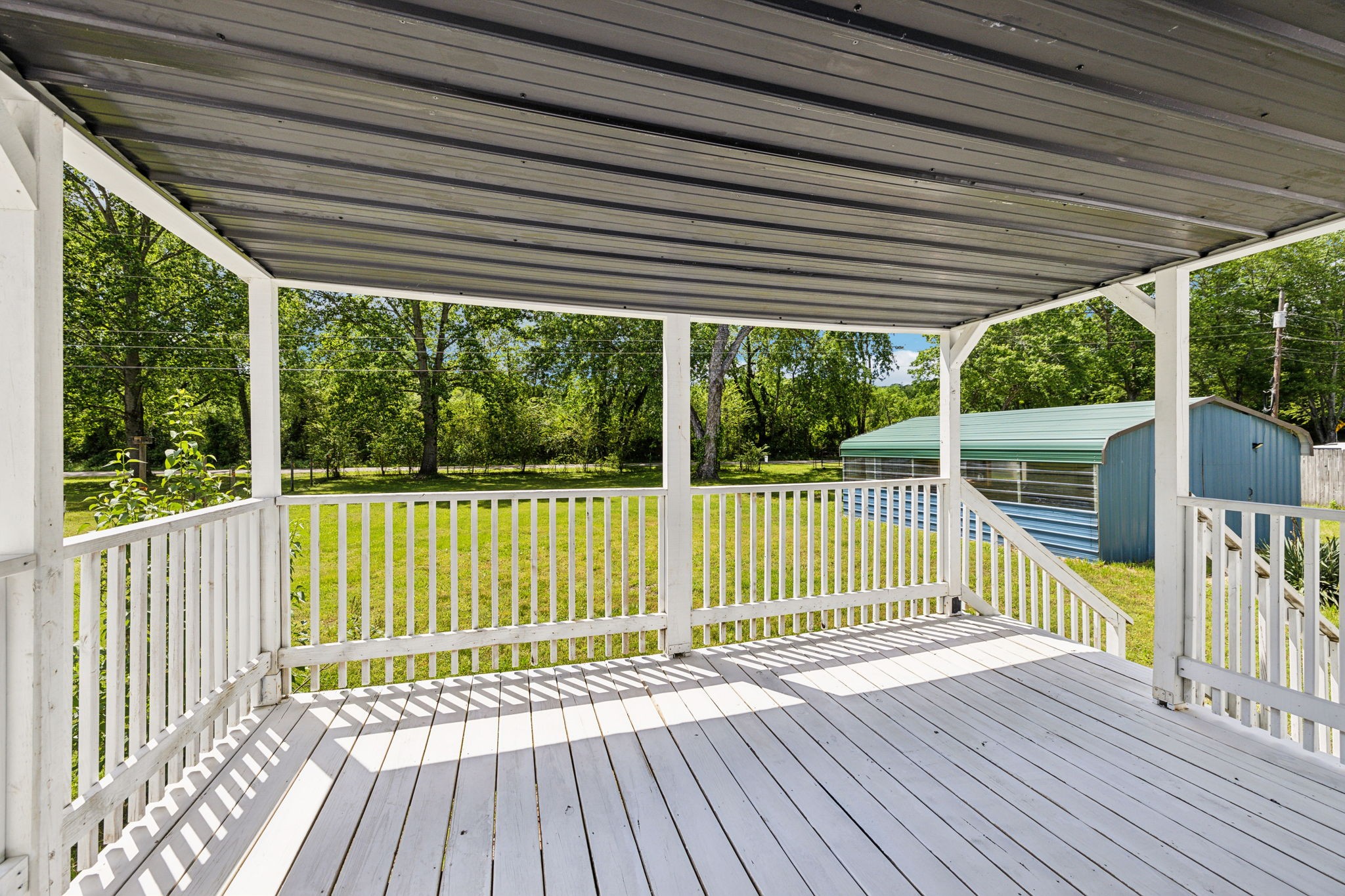 161 Longbranch Road Hohenwald, TN 38462 - Photo 4 of 28 a view of a wooden deck