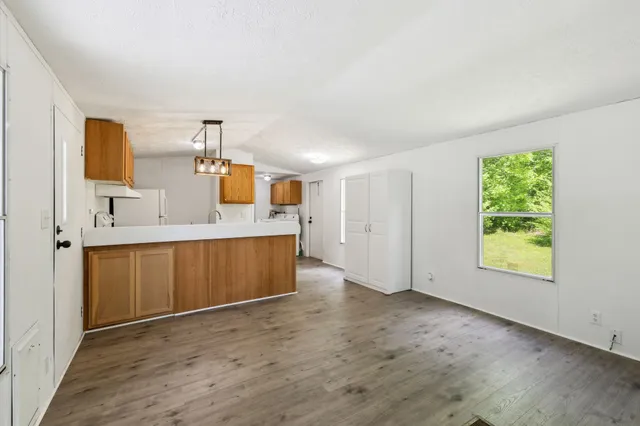 a view of a kitchen with a sink and a window