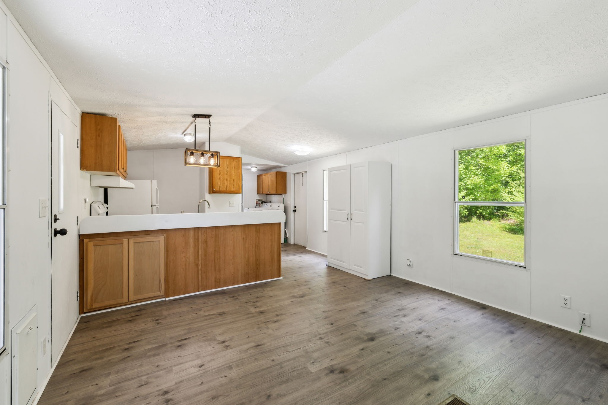 161 Longbranch Road Hohenwald, TN 38462 - Photo 8 of 28 a view of a kitchen with a sink and a window