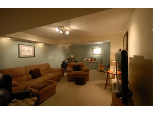 654 Bayfield Road Rockton, IL 61072 - Photo 11 of 11 a living room with furniture and a flat screen tv