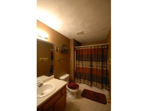 654 Bayfield Road Rockton, IL 61072 - Photo 8 of 11 a bathroom with a sink and a shower