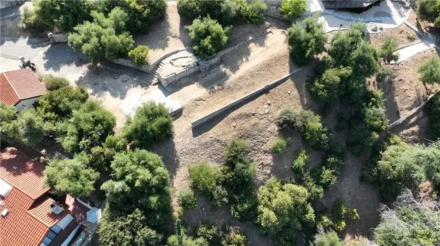an aerial view of a house with a yard and garden
