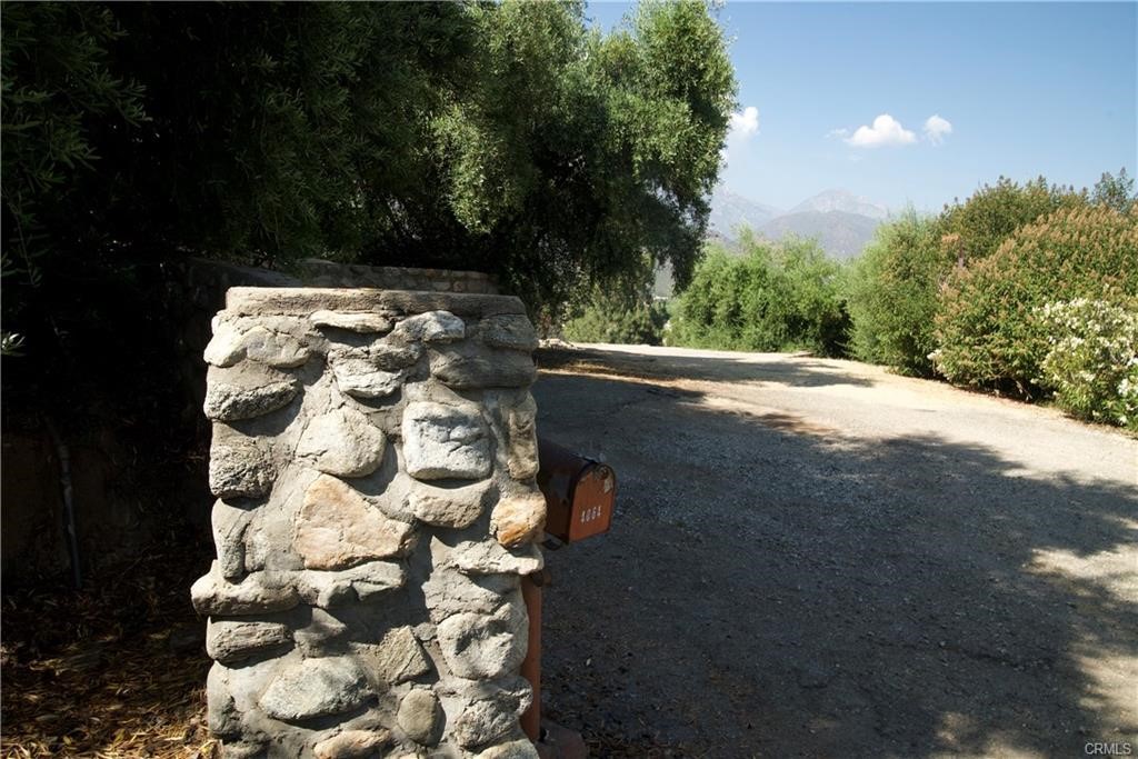 4064 Olive Knoll Place Claremont, CA 91711 - Photo 24 of 26 a backyard of a house with lots of green space