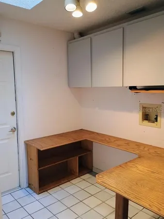 a kitchen with a sink and cabinets