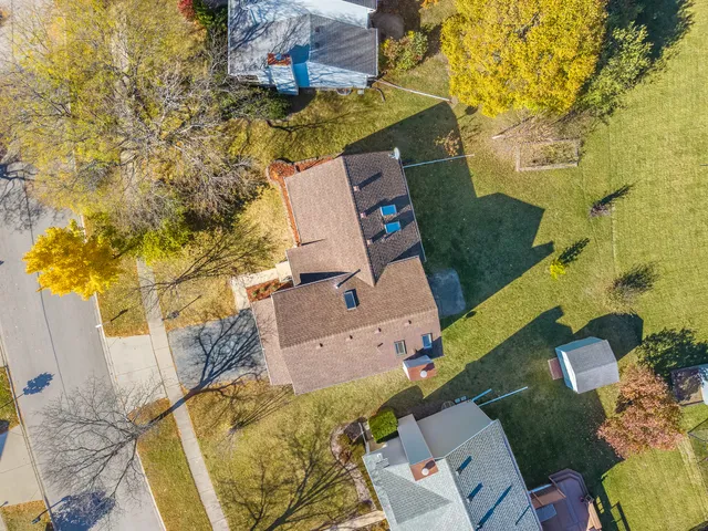 an aerial view of a house with swimming pool