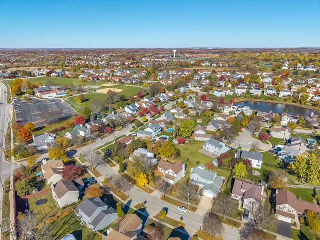 an aerial view of residential houses with outdoor space